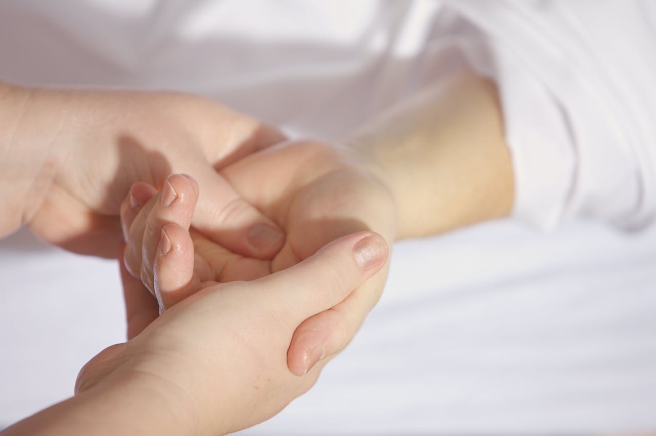 services-04 Relaxing hand massage therapy session close-up with gentle touch and care.